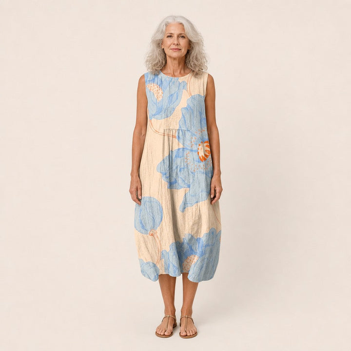 Daniela | Vestido midi sin mangas con flores azules sobre crema