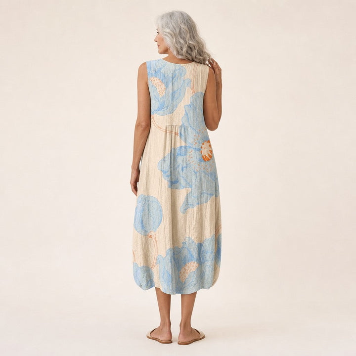 Daniela | Vestido midi sin mangas con flores azules sobre crema