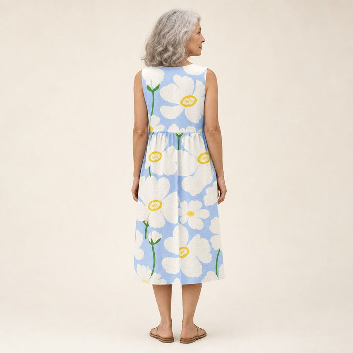 Adriana | Vestido midi sin mangas con flores blancas sobre azul claro
