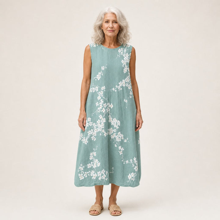 Juana | Vestido midi sin mangas con flor de cerezo sobre verde salvia