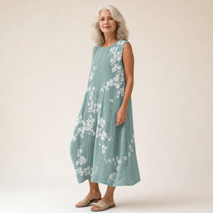 Juana | Vestido midi sin mangas con flor de cerezo sobre verde salvia
