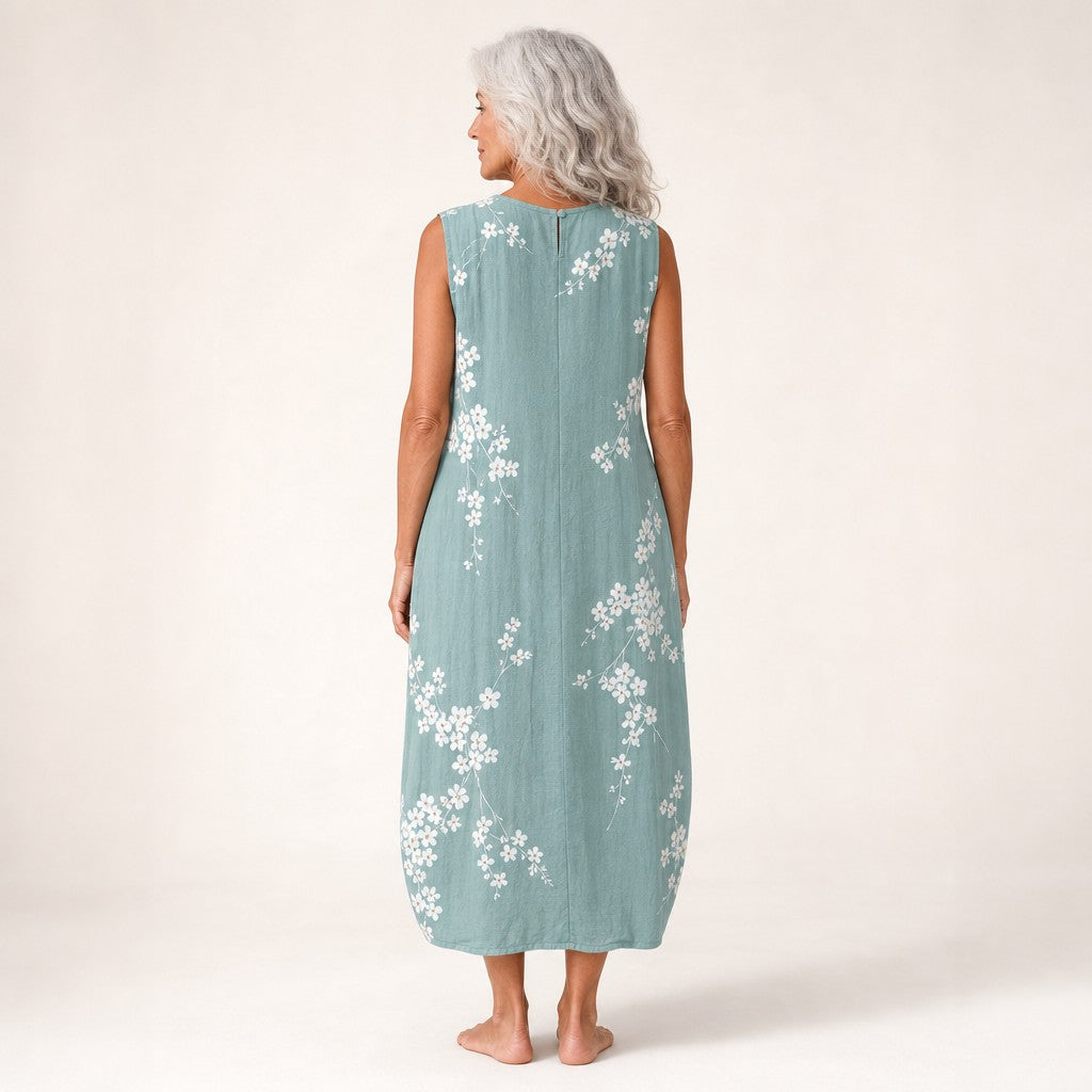 Juana | Vestido midi sin mangas con flor de cerezo sobre verde salvia