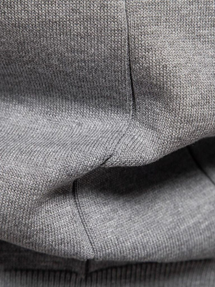 Amancio | Polo de punto camel con cuello de cremallera