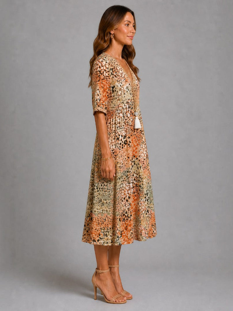 Aitana | Vestido midi con motivo floral en ocre