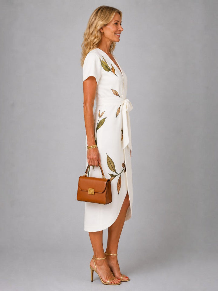 Andrea | Vestido cruzado en marfil con estampado de hojas