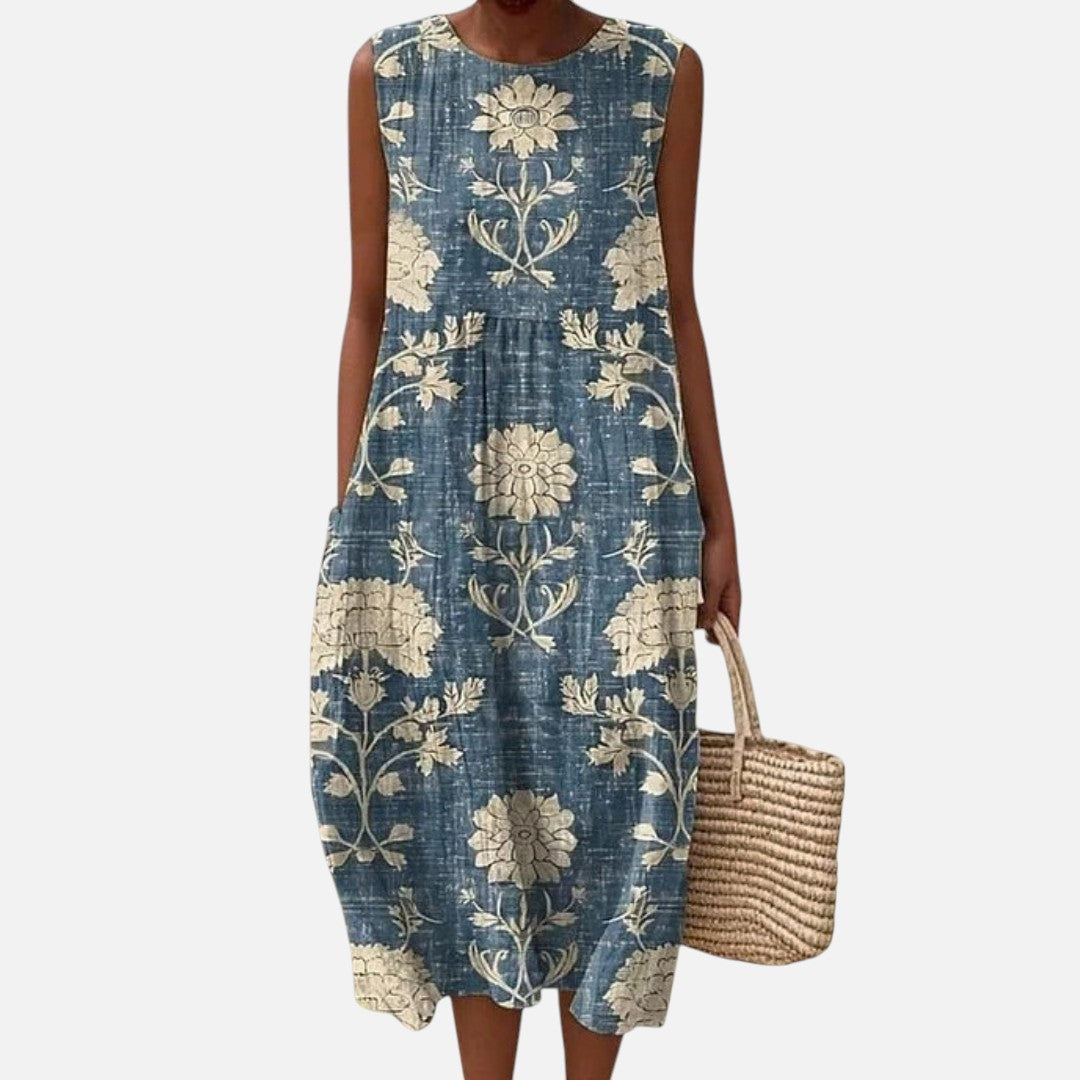 Celia | Vestido midi sin mangas con flores crema sobre azul