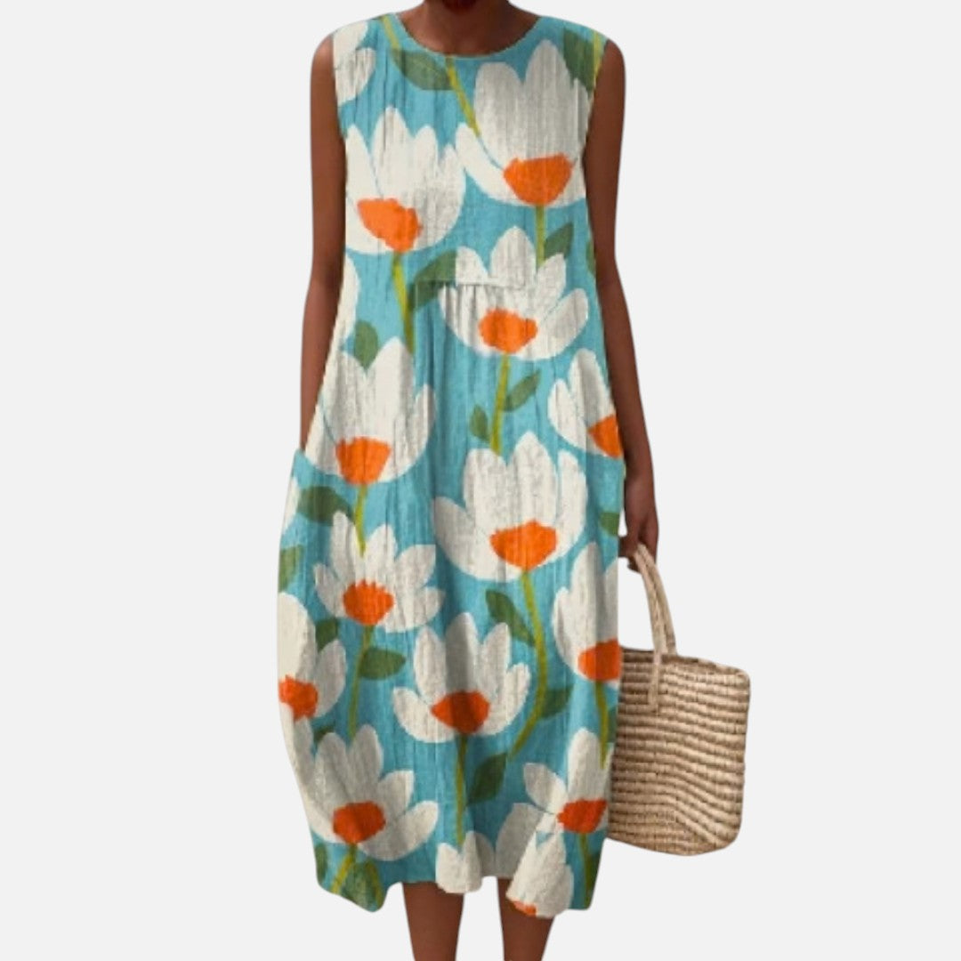 Eugenia | Vestido midi sin mangas con flores sobre turquesa