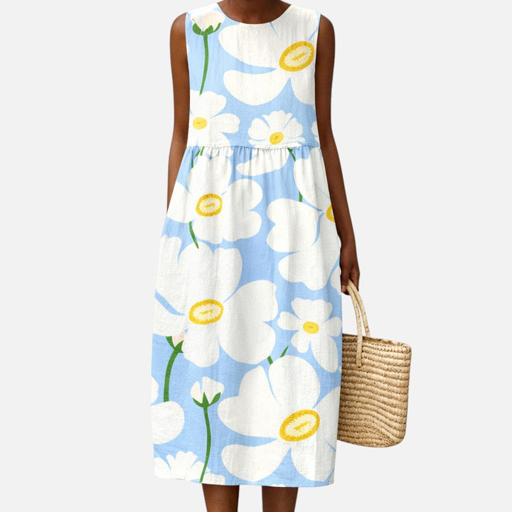 Adriana | Vestido midi sin mangas con flores blancas sobre azul claro