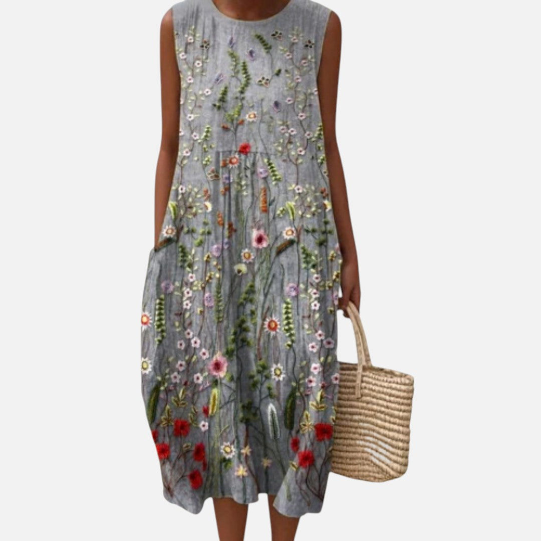 Inés | Vestido midi sin mangas con flores bordadas sobre gris