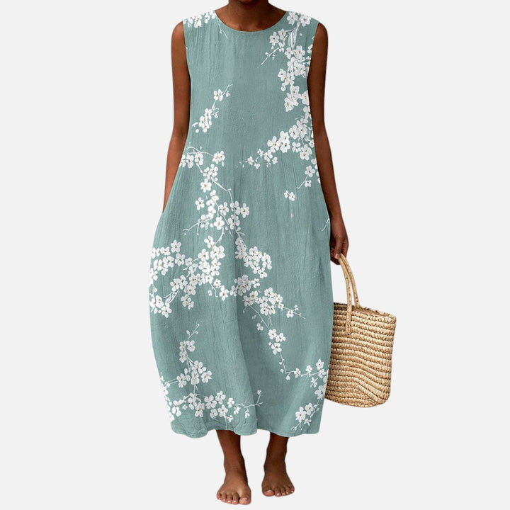 Juana | Vestido midi sin mangas con flor de cerezo sobre verde salvia